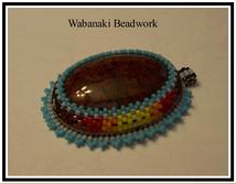 peyote stitch beadwork around stone cabochon